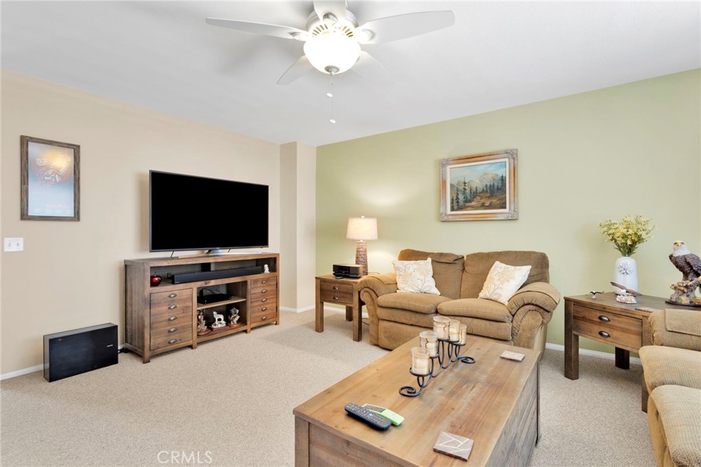 13798 Misty Path Victorville, CA 92392 - Photo 27 of 55 a living room with furniture and a flat screen tv