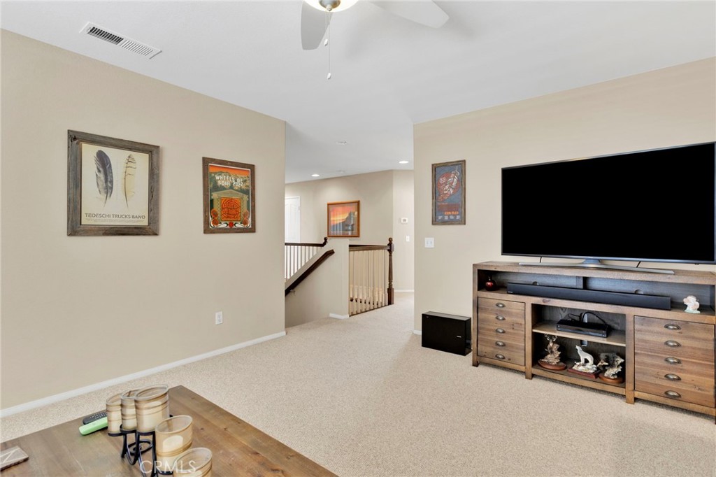 13798 Misty Path Victorville, CA 92392 - Photo 28 of 55 a living room with furniture and a flat screen tv