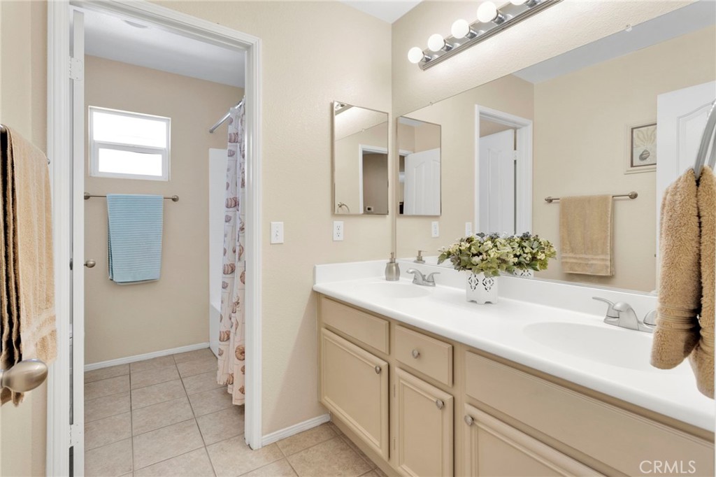 13798 Misty Path Victorville, CA 92392 - Photo 30 of 55 a bathroom with a sink and a mirror
