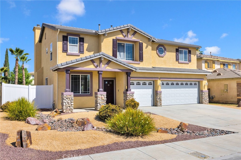 13798 Misty Path Victorville, CA 92392 - Photo 3 of 55 a front view of a house with a yard