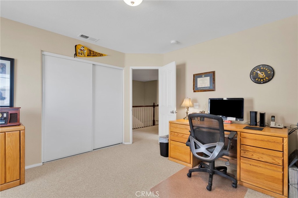 13798 Misty Path Victorville, CA 92392 - Photo 33 of 55 a view of a workspace with furniture and a window