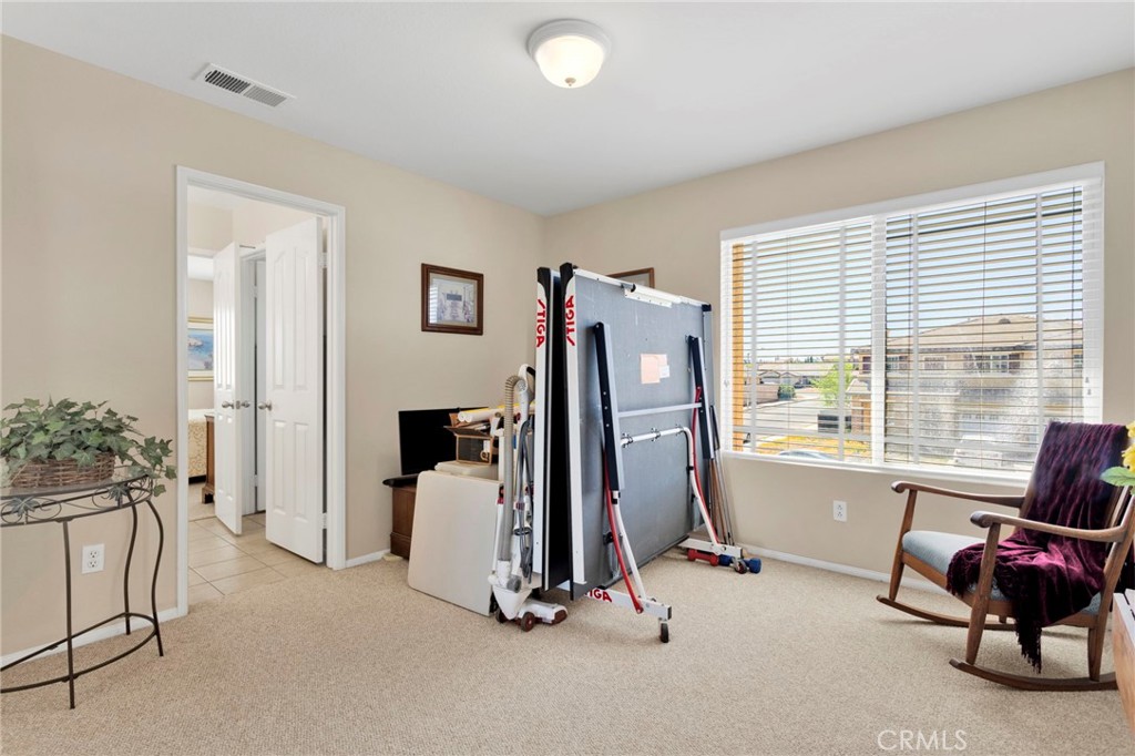 13798 Misty Path Victorville, CA 92392 - Photo 34 of 55 a view of a room with gym equipment