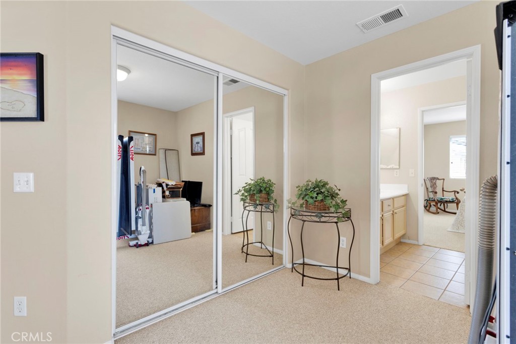13798 Misty Path Victorville, CA 92392 - Photo 35 of 55 a view of a livingroom with wooden floor and a flat screen tv