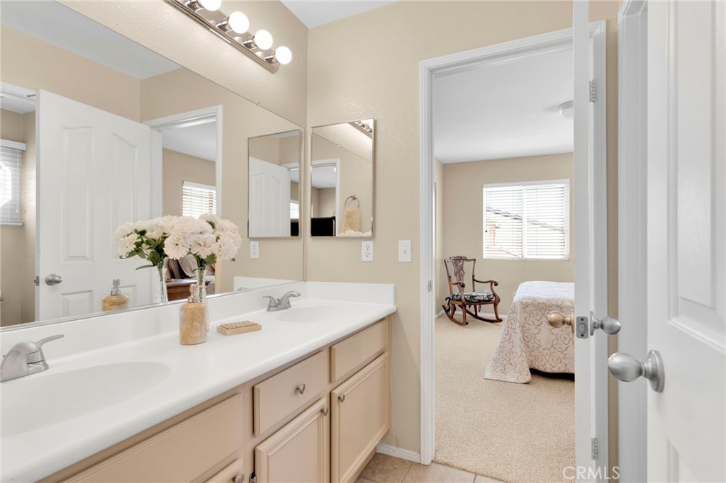 13798 Misty Path Victorville, CA 92392 - Photo 36 of 55 a bathroom with a sink double vanity and a mirror