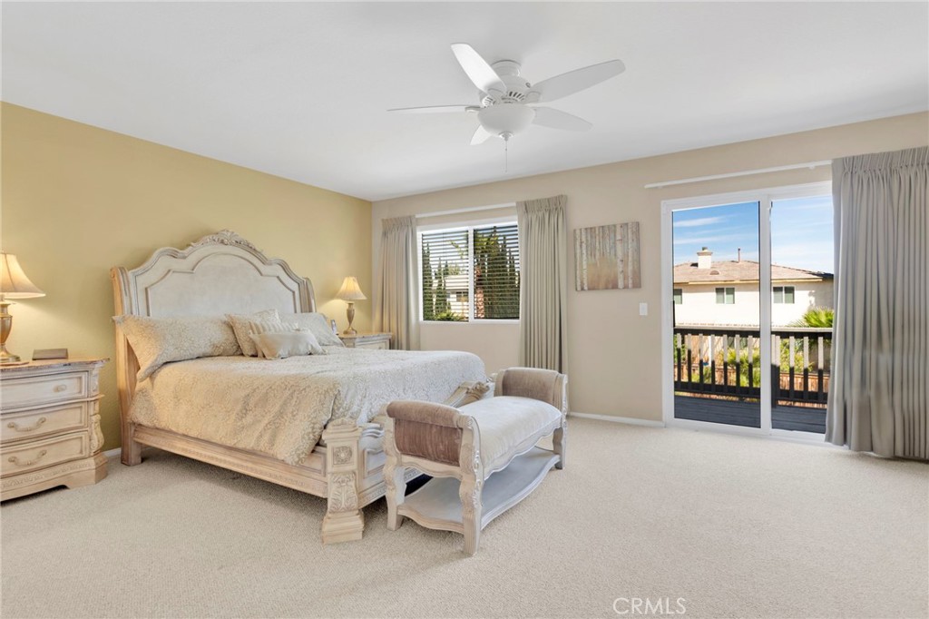 13798 Misty Path Victorville, CA 92392 - Photo 40 of 55 a bedroom with a bed and a chandelier
