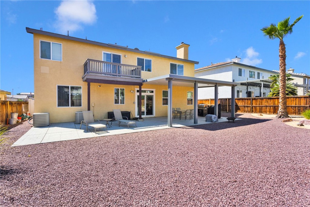 13798 Misty Path Victorville, CA 92392 - Photo 52 of 55 a front view of a house with a yard