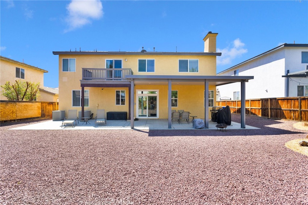 13798 Misty Path Victorville, CA 92392 - Photo 53 of 55 a front view of a house with a yard