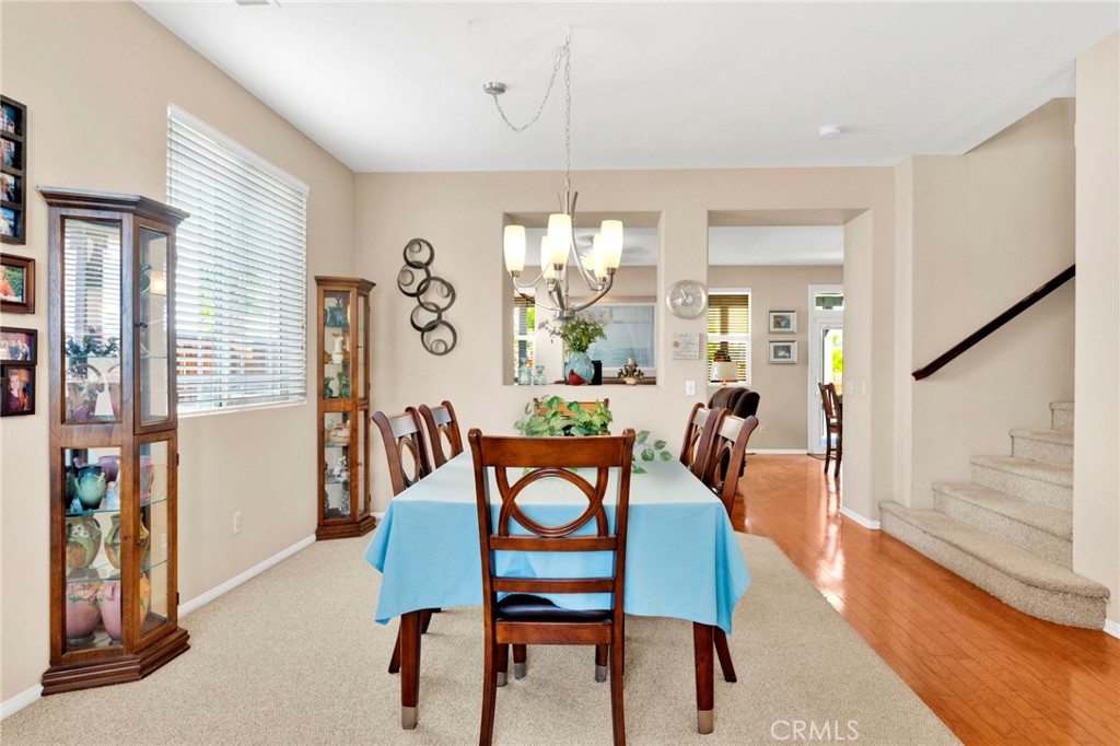 13798 Misty Path Victorville, CA 92392 - Photo 7 of 55 a view of a dining room with furniture window and wooden floor