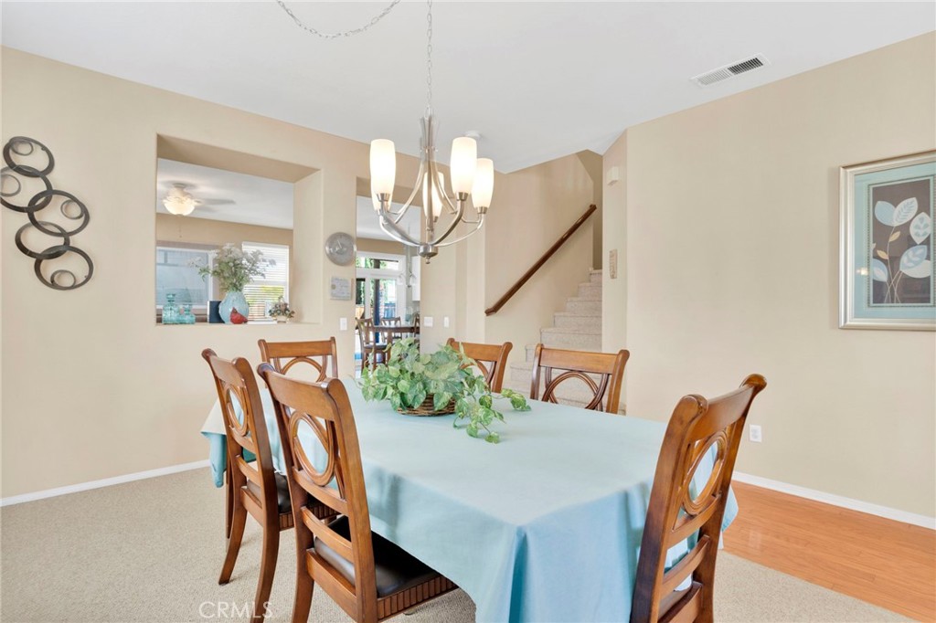 13798 Misty Path Victorville, CA 92392 - Photo 8 of 55 a view of a dining room with furniture and wooden floor