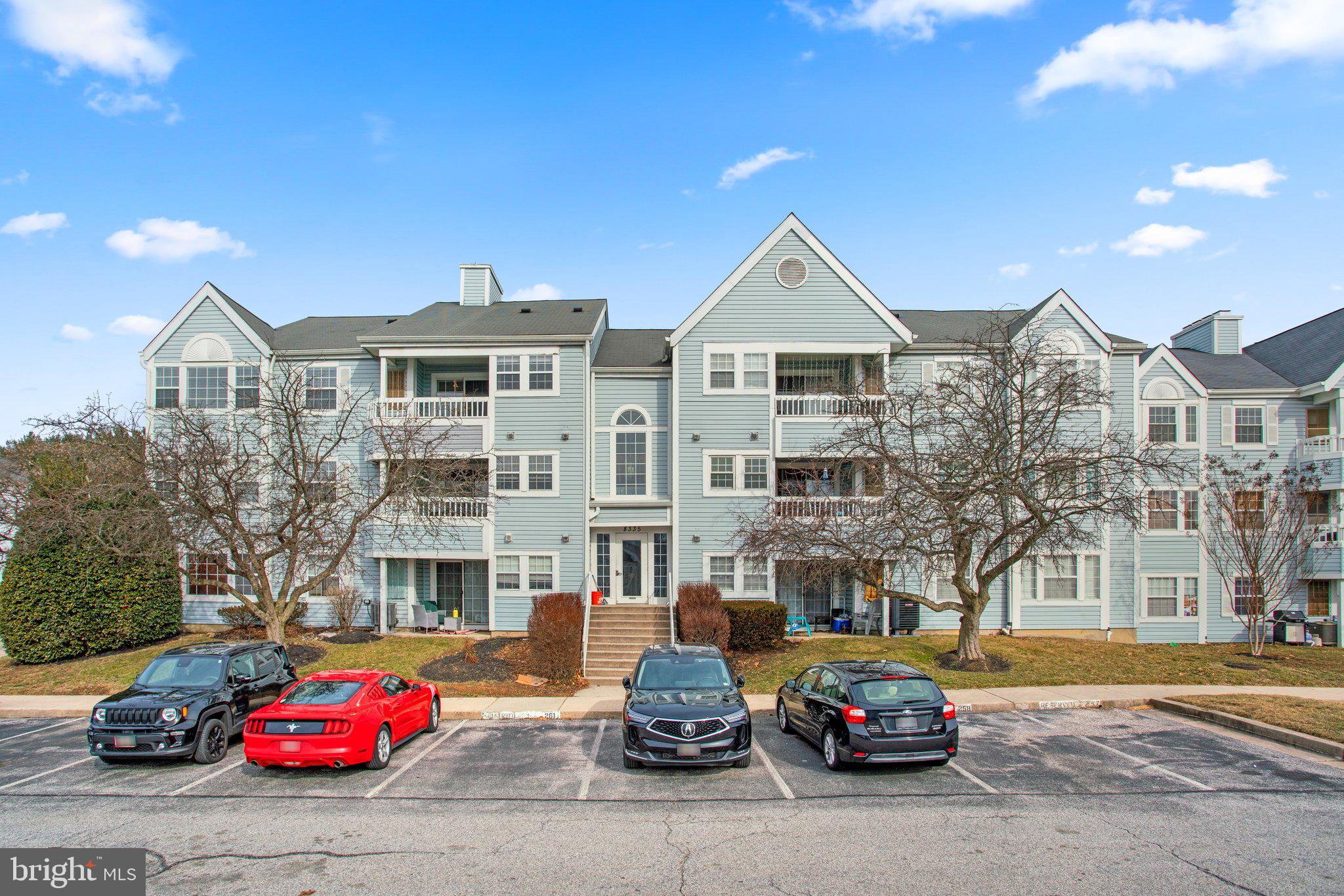 8335 Montgomery Run Road, Unit K Ellicott City, MD 21043 - Photo 2 of 42 a car parked in front of a building