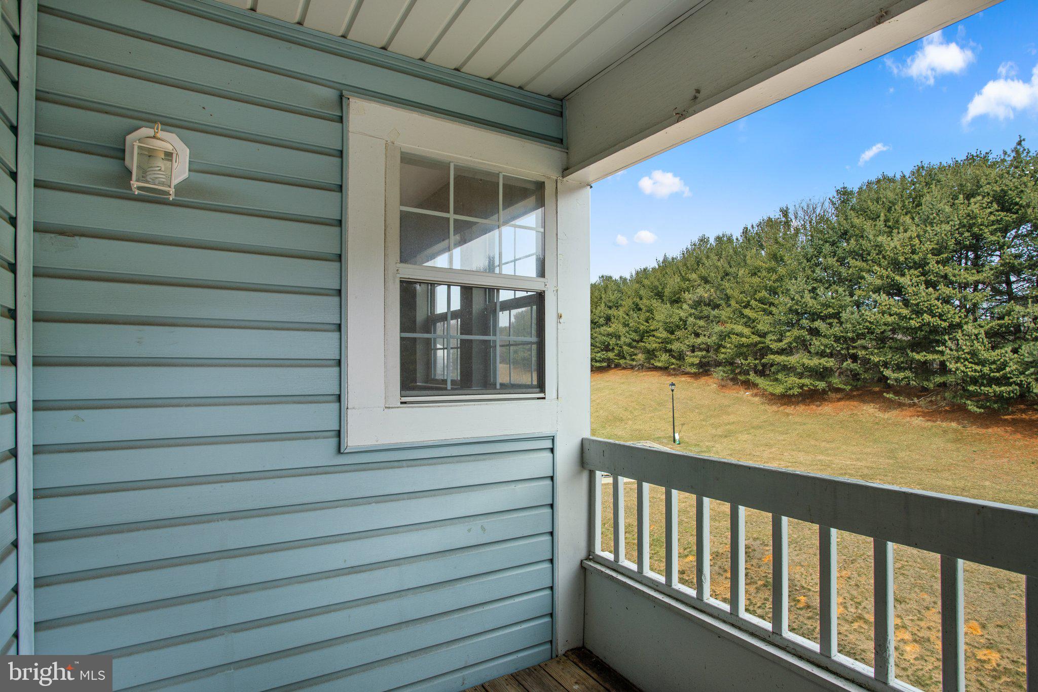 8335 Montgomery Run Road, Unit K Ellicott City, MD 21043 - Photo 22 of 42 a view of a balcony with a tree