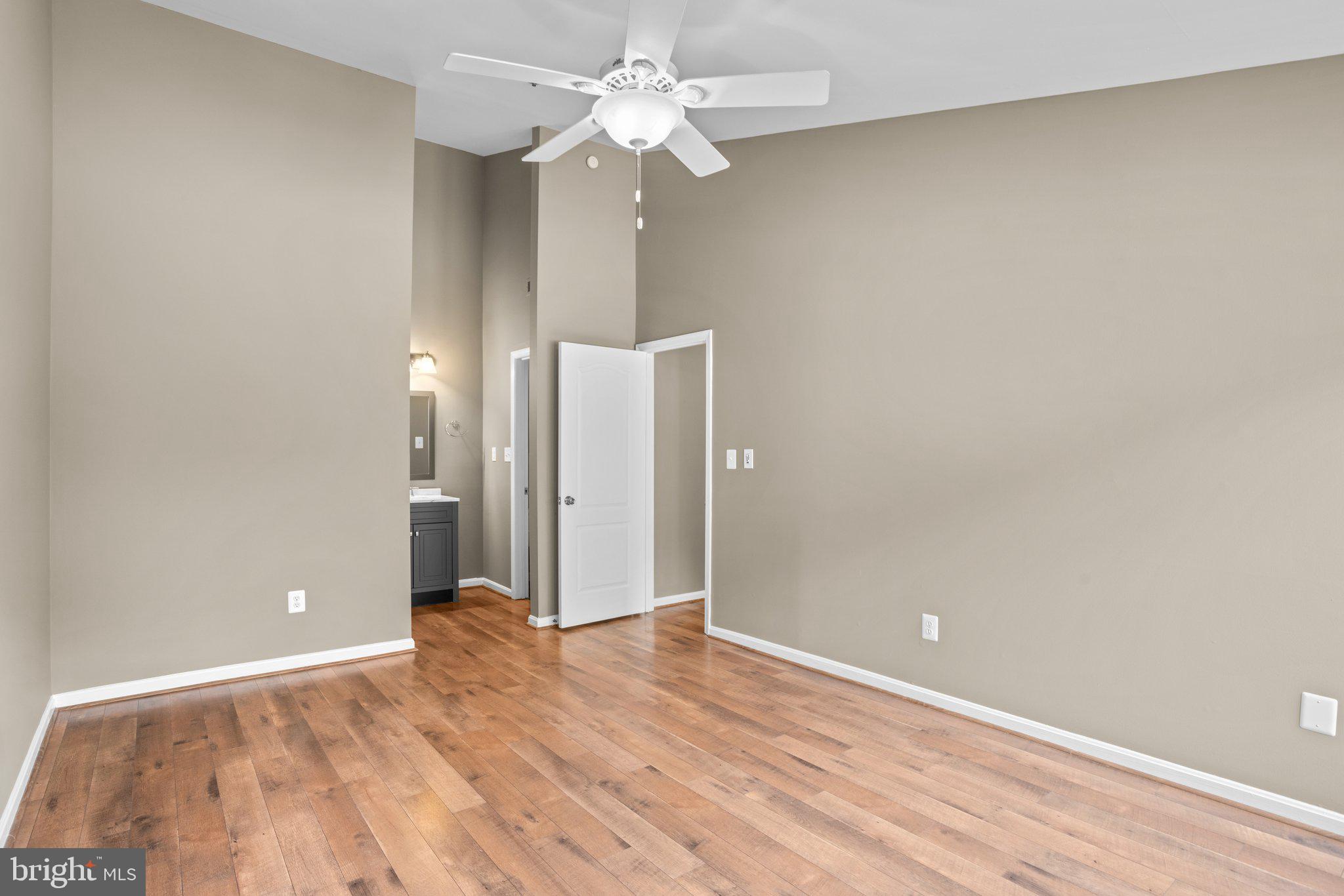 8335 Montgomery Run Road, Unit K Ellicott City, MD 21043 - Photo 28 of 42 a view of an empty room with a fan