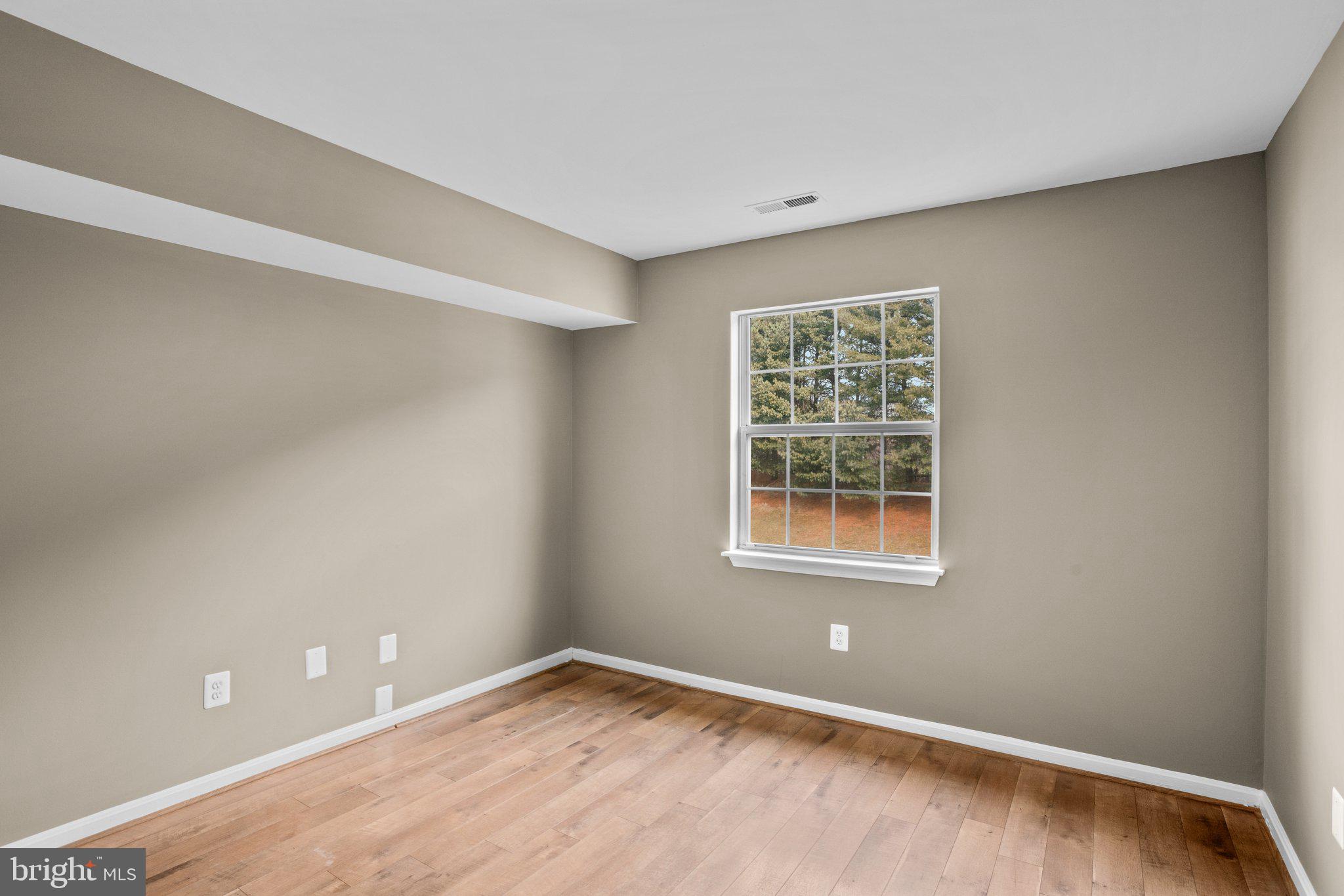 8335 Montgomery Run Road, Unit K Ellicott City, MD 21043 - Photo 34 of 42 a view of an empty room with a window