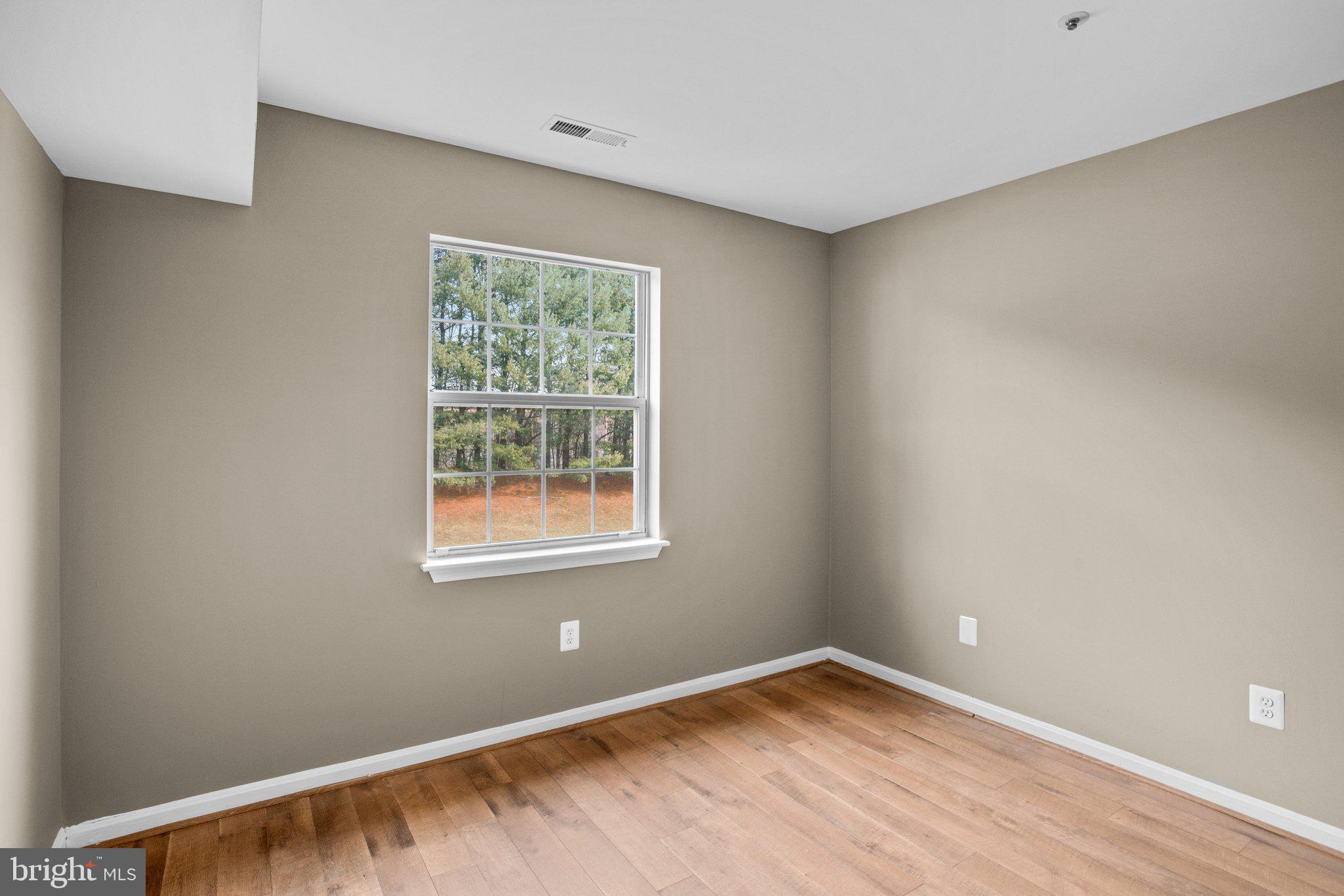 8335 Montgomery Run Road, Unit K Ellicott City, MD 21043 - Photo 35 of 42 an empty room with a window