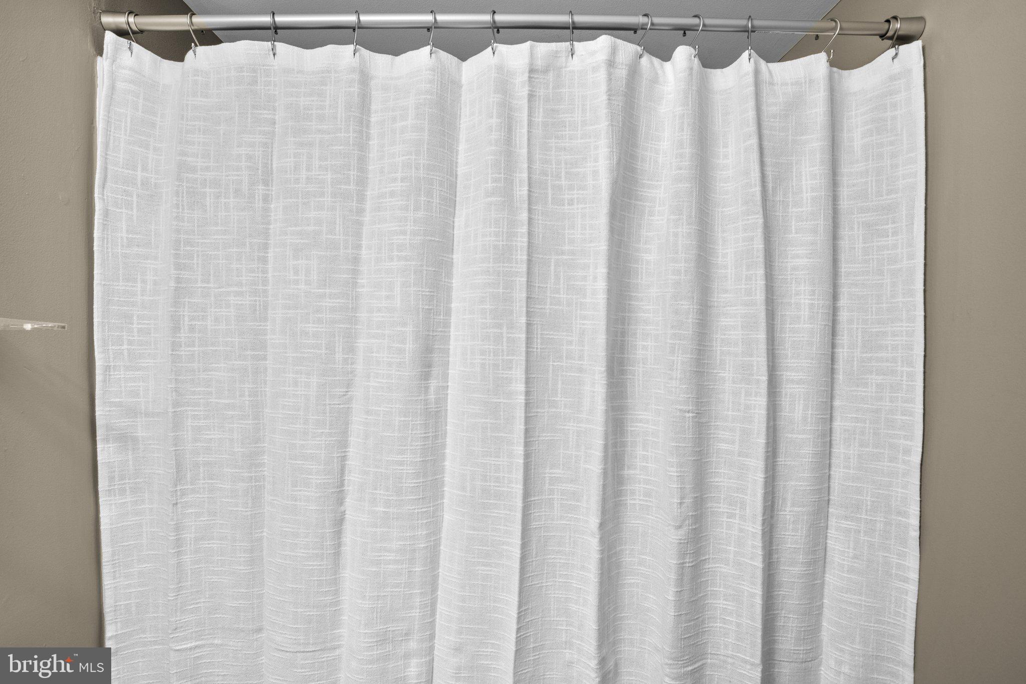 8335 Montgomery Run Road, Unit K Ellicott City, MD 21043 - Photo 39 of 42 a close up of a white curtain