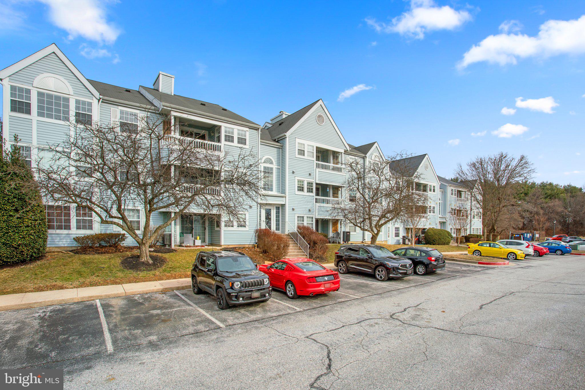 8335 Montgomery Run Road, Unit K Ellicott City, MD 21043 - Photo 41 of 42 a car parked in front of a building