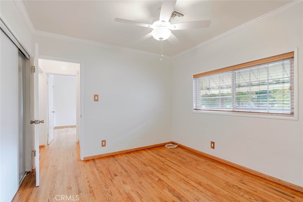 835 North Lincoln Street Burbank, CA 91506 - Photo 15 of 38 a view of empty room with wooden floor and fan