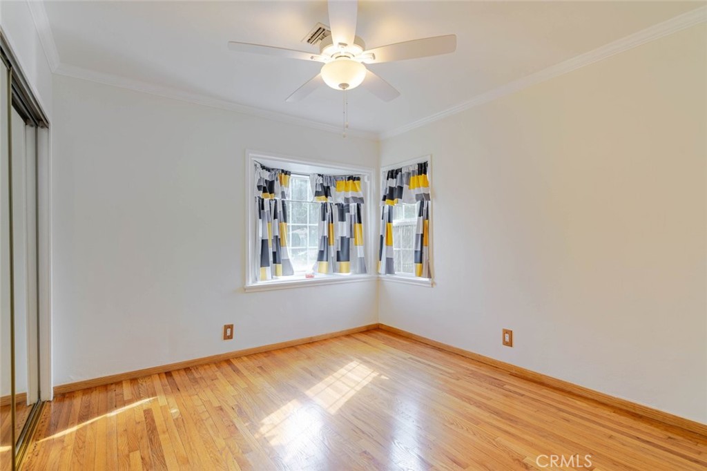 835 North Lincoln Street Burbank, CA 91506 - Photo 19 of 38 a view of a bedroom with a bed and a chandelier