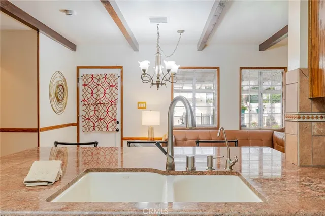 a kitchen with stainless steel appliances granite countertop a stove and cabinets