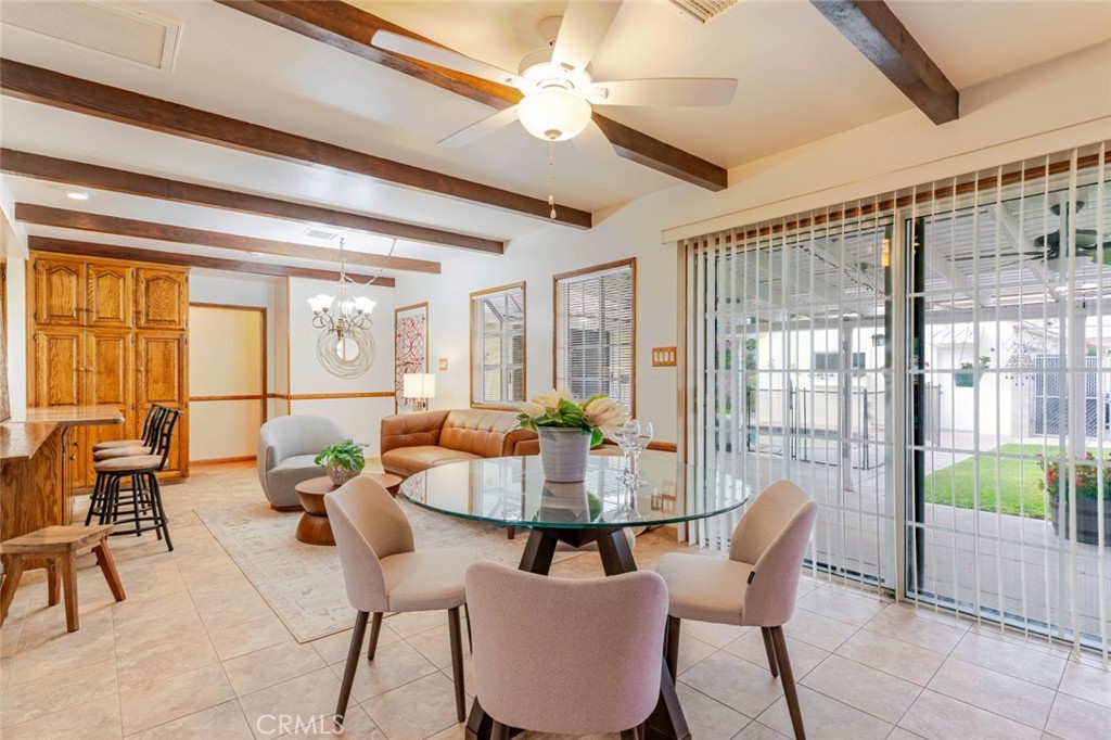 835 North Lincoln Street Burbank, CA 91506 - Photo 30 of 38 a dining room with furniture a chandelier and wooden floor