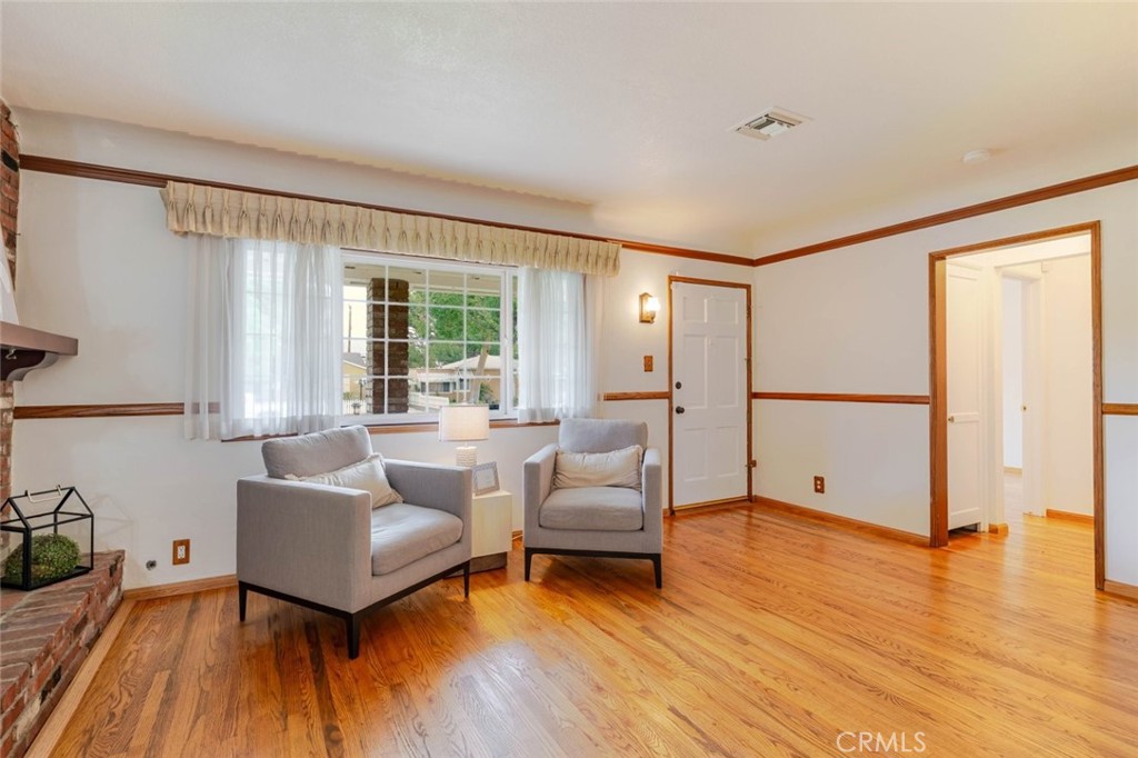 835 North Lincoln Street Burbank, CA 91506 - Photo 5 of 38 a living room with furniture and a wooden floor