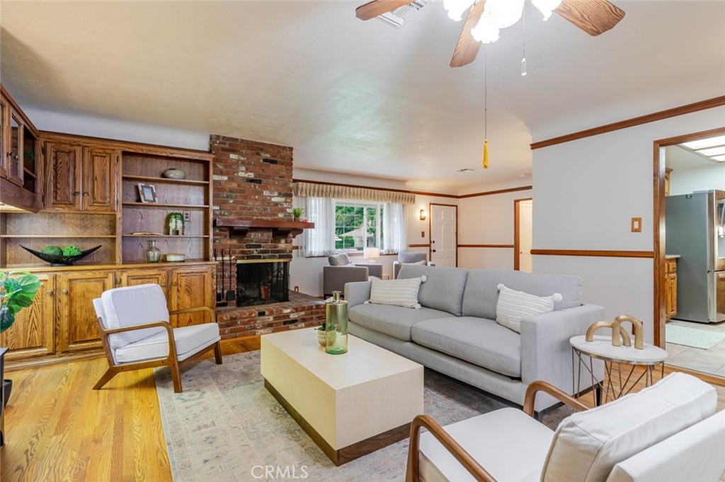 835 North Lincoln Street Burbank, CA 91506 - Photo 7 of 38 a living room with furniture a fireplace and a flat screen tv