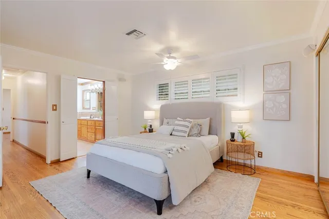 a bedroom with a bed and a couch