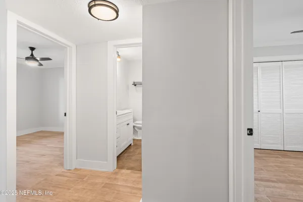 wooden floor with white cabinet