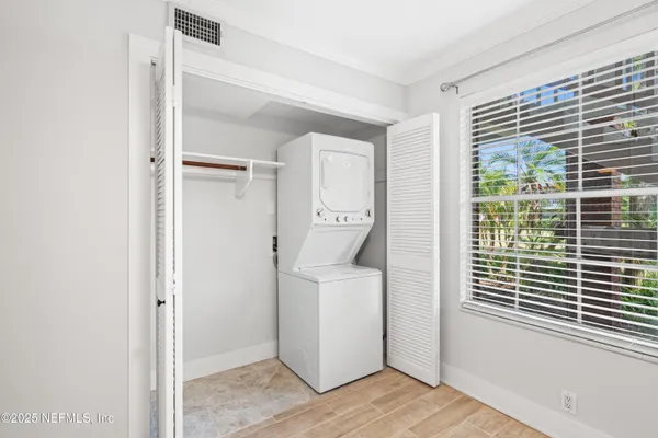 a utility room with a window dryer and washer
