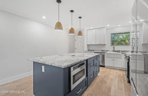 a kitchen with a stove and a sink