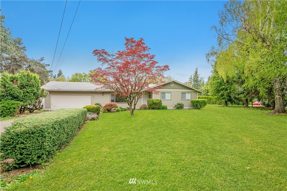 6891 Old Guide Road Lynden, WA 98264 - Photo 1 of 32 a front view of a house with a yard and trees