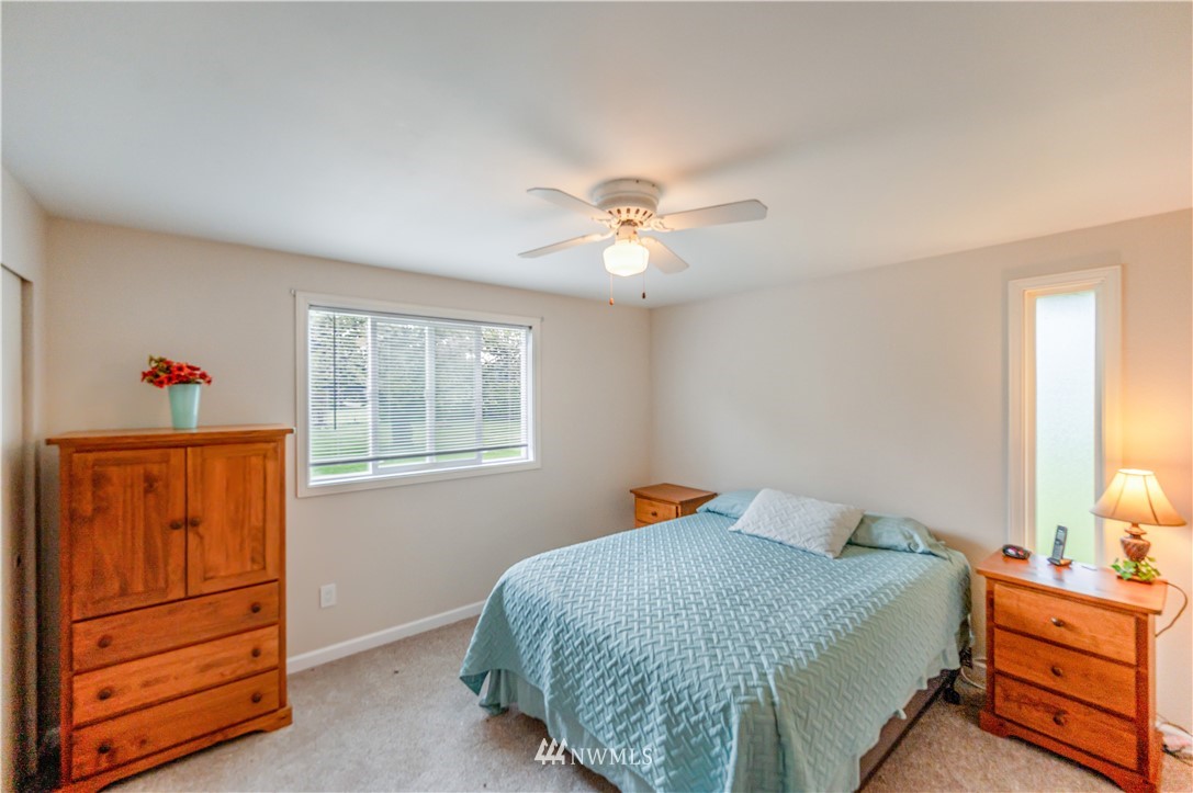 6891 Old Guide Road Lynden, WA 98264 - Photo 22 of 32 a bed room with a bed and a window