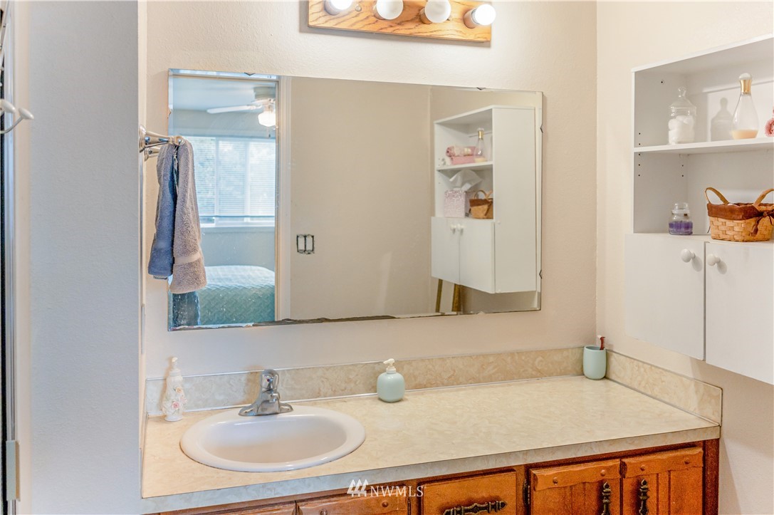 6891 Old Guide Road Lynden, WA 98264 - Photo 24 of 32 a bathroom with a sink and a mirror