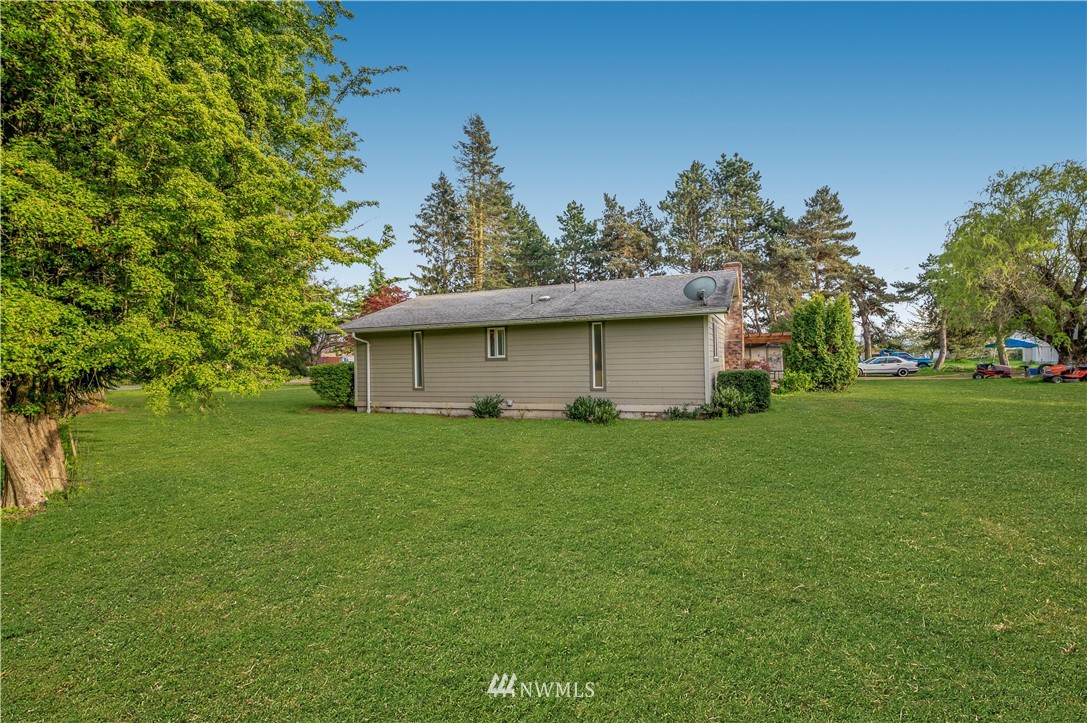 6891 Old Guide Road Lynden, WA 98264 - Photo 30 of 32 a view of a house with a backyard
