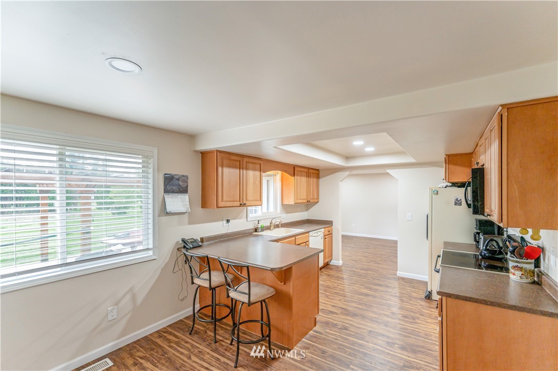 6891 Old Guide Road Lynden, WA 98264 - Photo 9 of 32 a dining room with furniture and wooden floor
