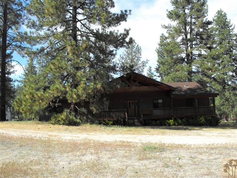 59320 Devils Ladder Road Mountain Center, CA 92561 - Photo 1 of 19 a view of a house with a yard
