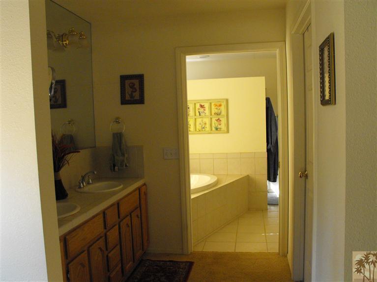 59320 Devils Ladder Road Mountain Center, CA 92561 - Photo 14 of 19 a bathroom with a sink and mirror with toilet