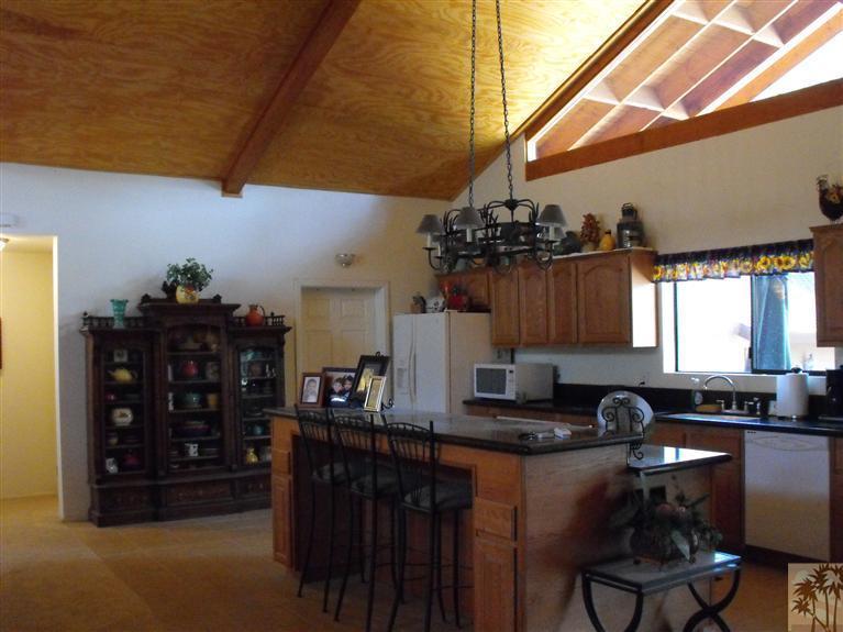 59320 Devils Ladder Road Mountain Center, CA 92561 - Photo 17 of 19 a kitchen with granite countertop a sink and cabinets
