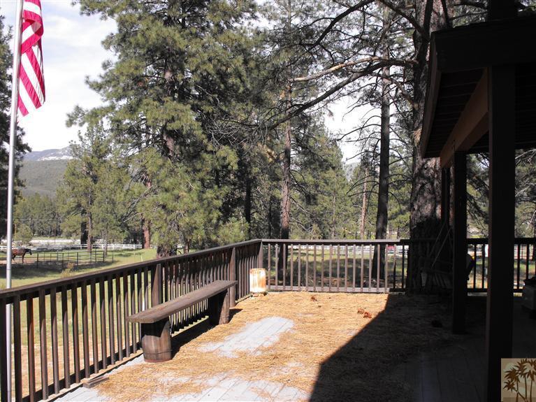 59320 Devils Ladder Road Mountain Center, CA 92561 - Photo 3 of 19 a view of balcony with wooden fence and trees