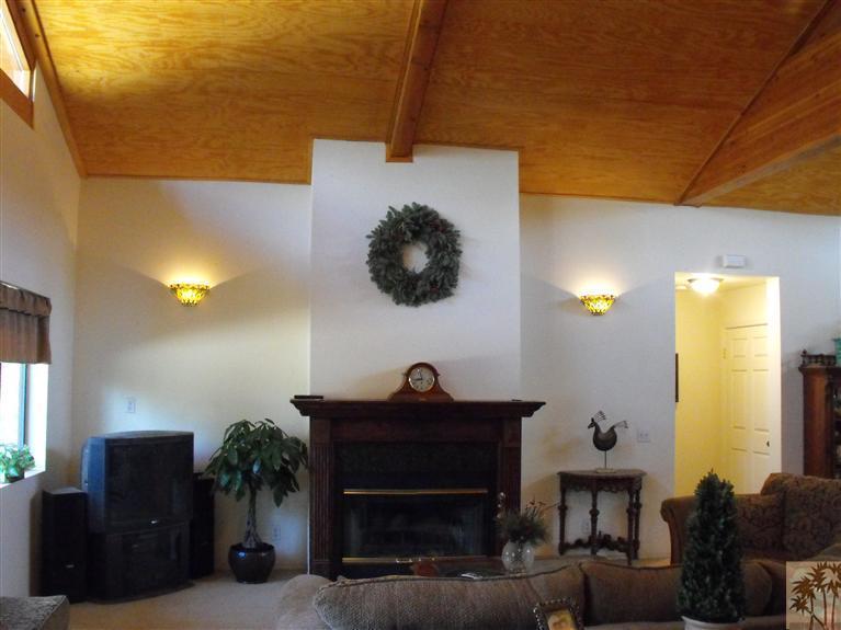 59320 Devils Ladder Road Mountain Center, CA 92561 - Photo 6 of 19 a living room with furniture and a fireplace
