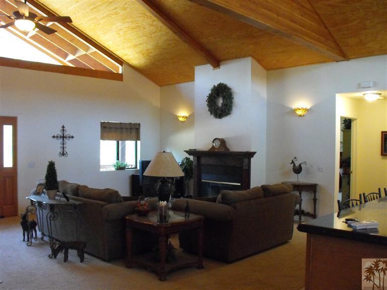 59320 Devils Ladder Road Mountain Center, CA 92561 - Photo 7 of 19 a living room with furniture and a flat screen tv