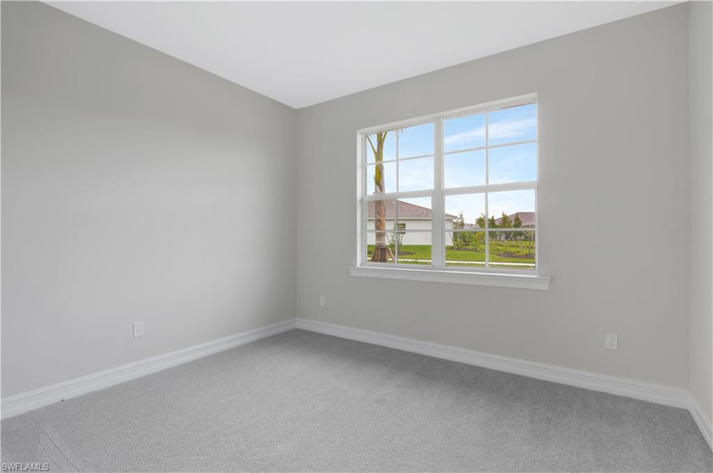 335 Tamarindo Lane Naples, FL 34114 - Photo 18 of 38 an empty room with a window