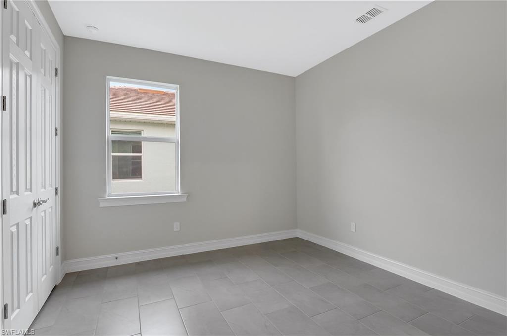335 Tamarindo Lane Naples, FL 34114 - Photo 23 of 38 an empty room with a window