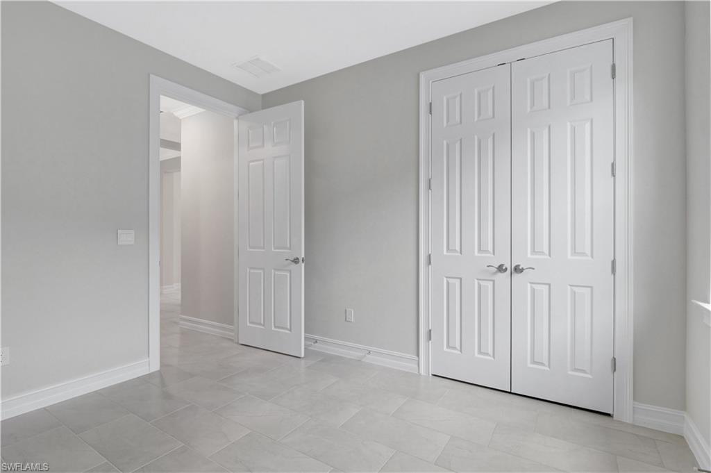 335 Tamarindo Lane Naples, FL 34114 - Photo 24 of 38 a view of an empty room with entryway