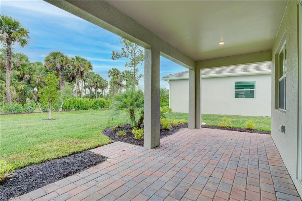 335 Tamarindo Lane Naples, FL 34114 - Photo 26 of 38 a view of a porch with a backyard