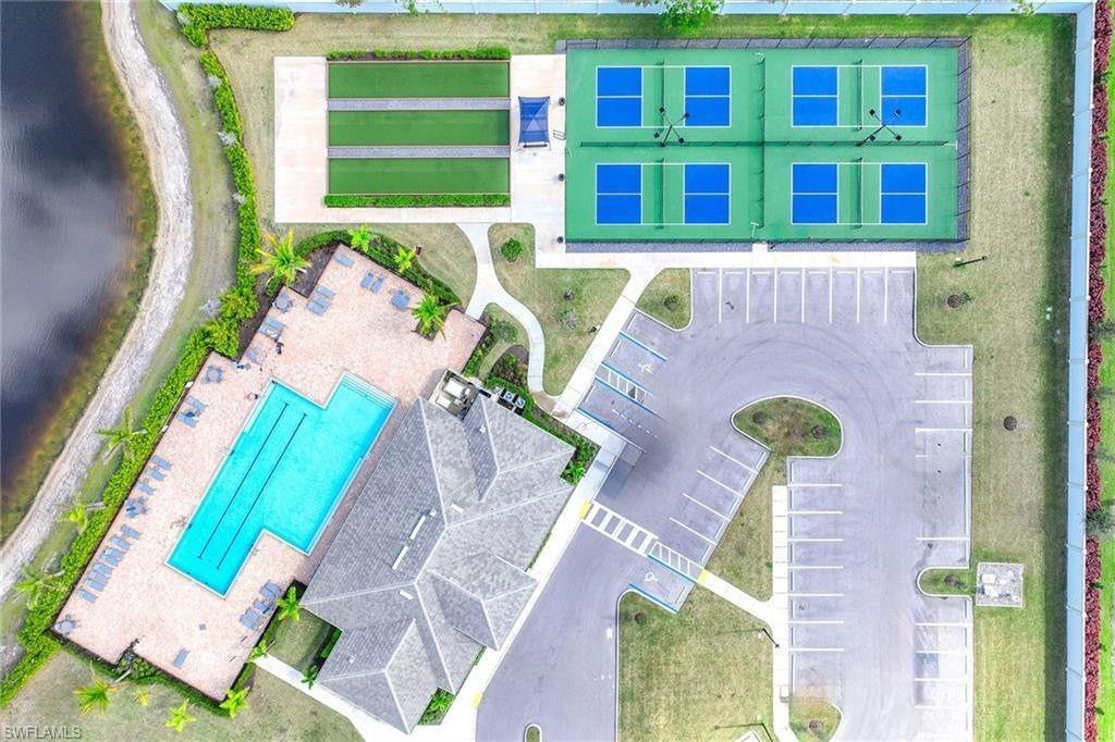 335 Tamarindo Lane Naples, FL 34114 - Photo 32 of 38 a front view of a house with a yard