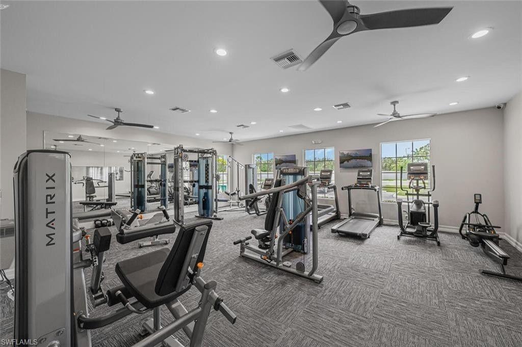 335 Tamarindo Lane Naples, FL 34114 - Photo 34 of 38 a view of a room with gym equipment