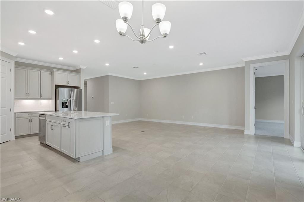 335 Tamarindo Lane Naples, FL 34114 - Photo 6 of 38 a view of a kitchen with electric appliances