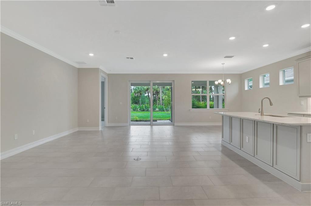 335 Tamarindo Lane Naples, FL 34114 - Photo 38 of 38 a view of a kitchen with a sink and a window