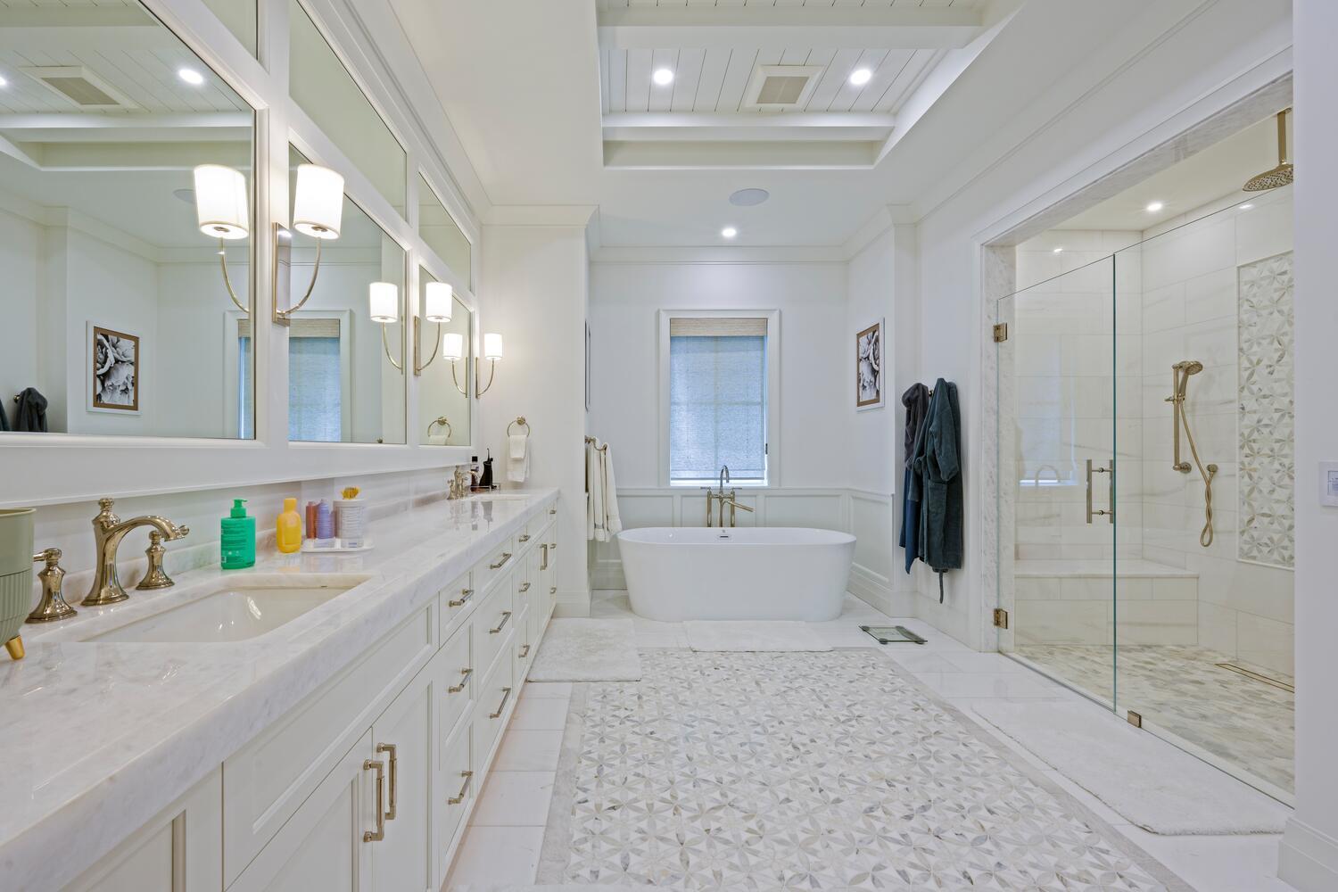 643 Pilot Road North Palm Beach, FL 33408 - Photo 15 of 73 a large bathroom with a double vanity sink a large mirror and shower